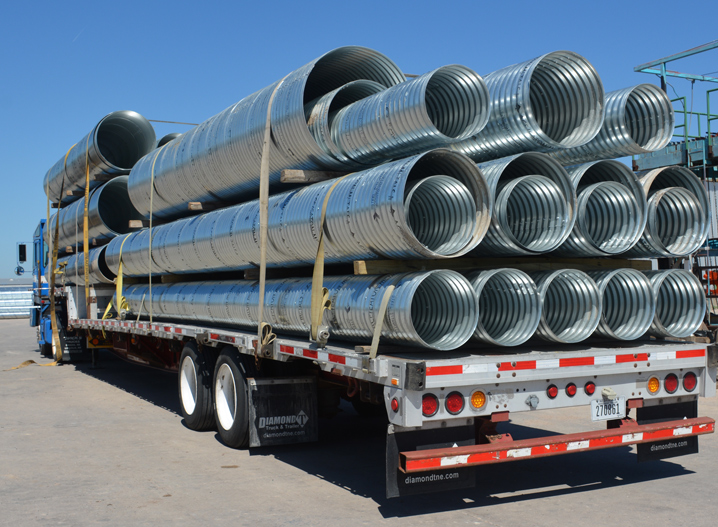 Semi trailer loaded with culverts of different diameters ready for delivery